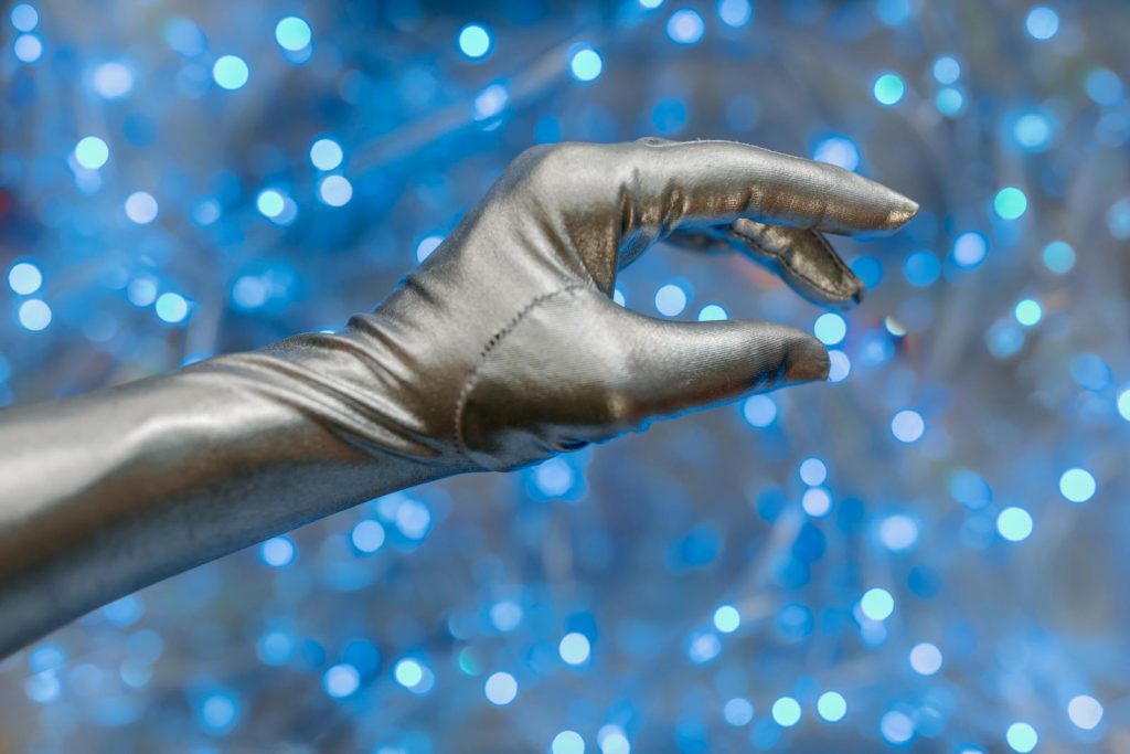 Hand Wearing a Silver Glove